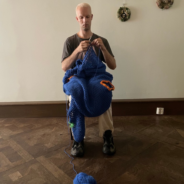 A man knitting
