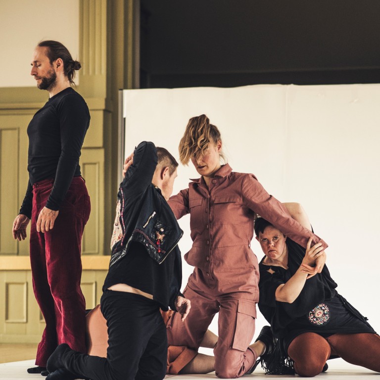 Five people entangled on the floor